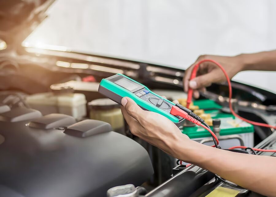 technician-is-checking-car-battery-availability_539854-967